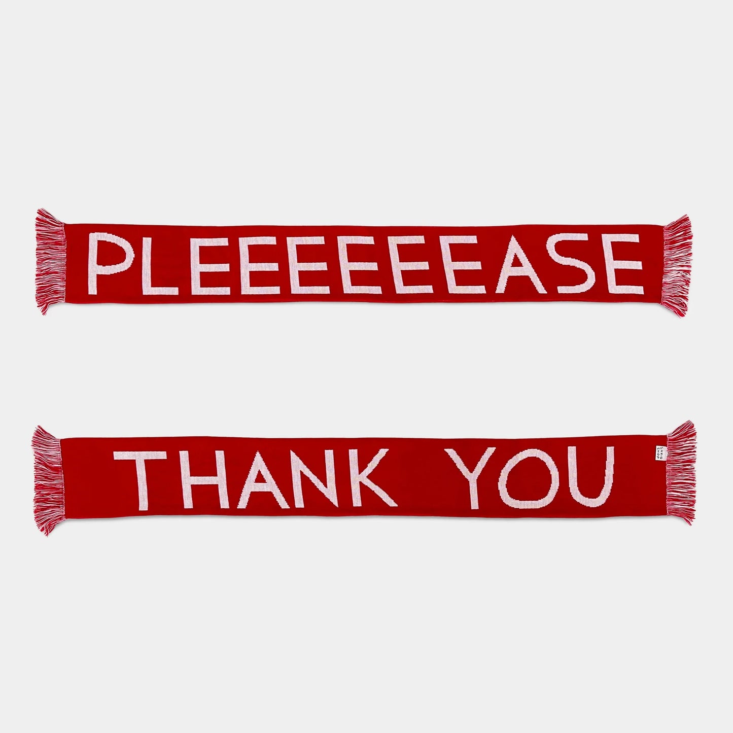 Two red scarves with white text on a white background