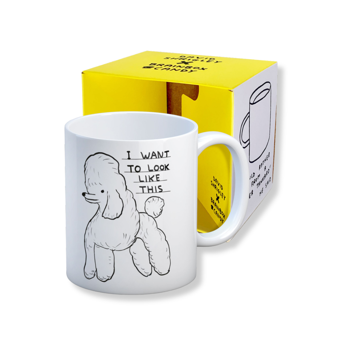 A white stoneware mug with a black line drawing of a poodle and the phrase 'I WANT TO LOOK LIKE THIS' above it, accompanied by its yellow box packaging.