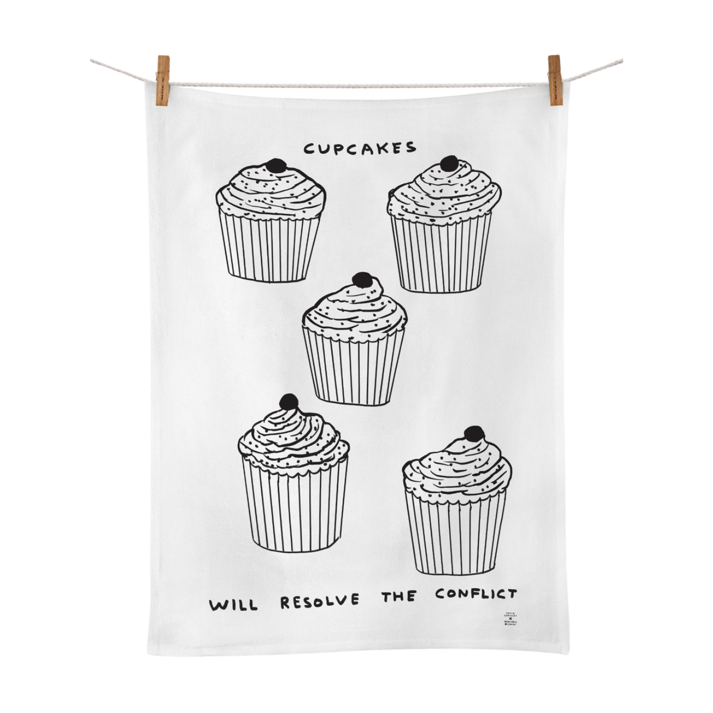 A white cotton tea towel with black printed cupcakes and the text 'CUPCAKES WILL RESOLVE THE CONFLICT'.