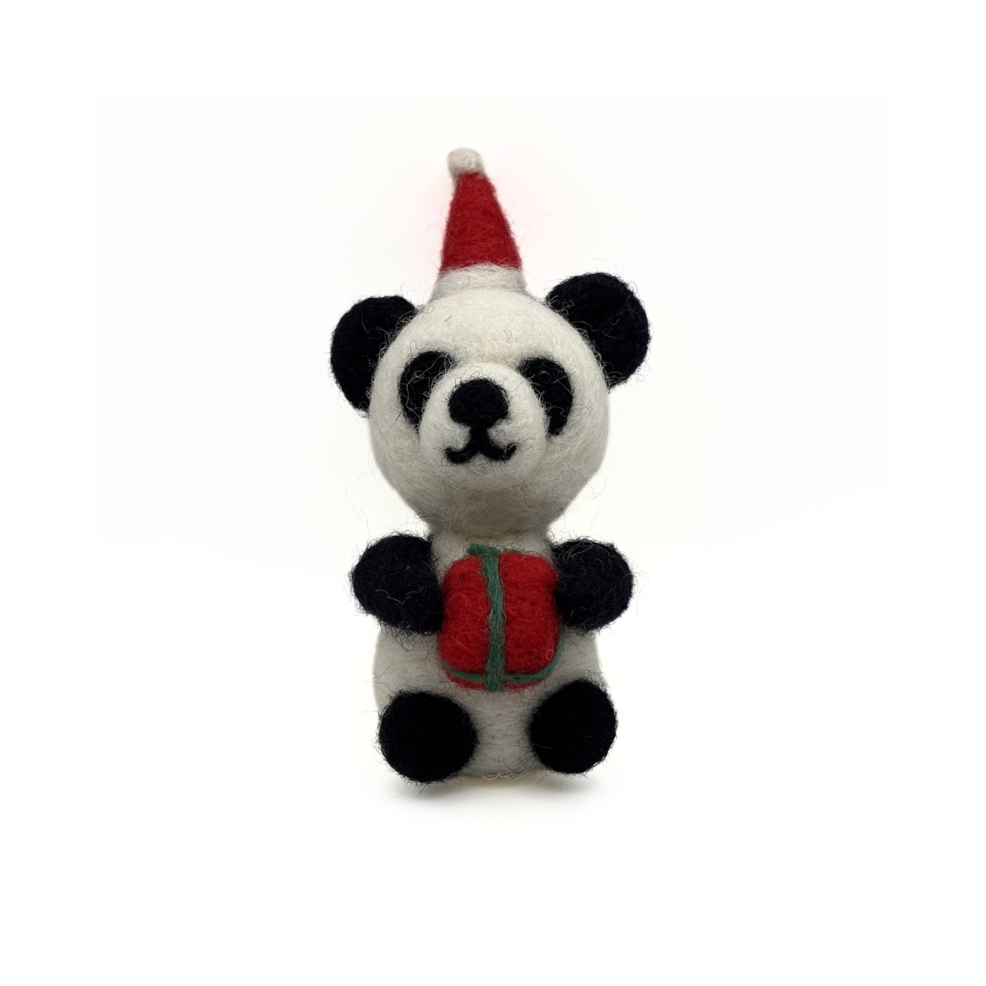 Felt panda decoration wearing a Santa hat and holding a red present sitting against a white background