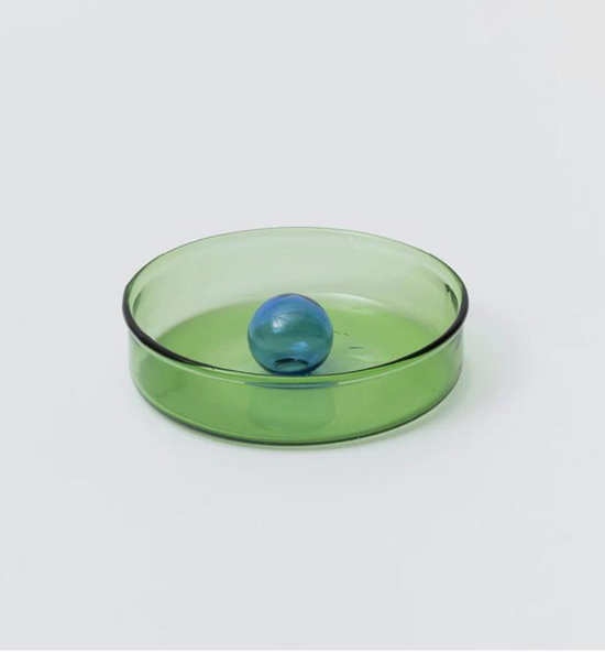 glass green dish with blue bubble ornament in the centre.