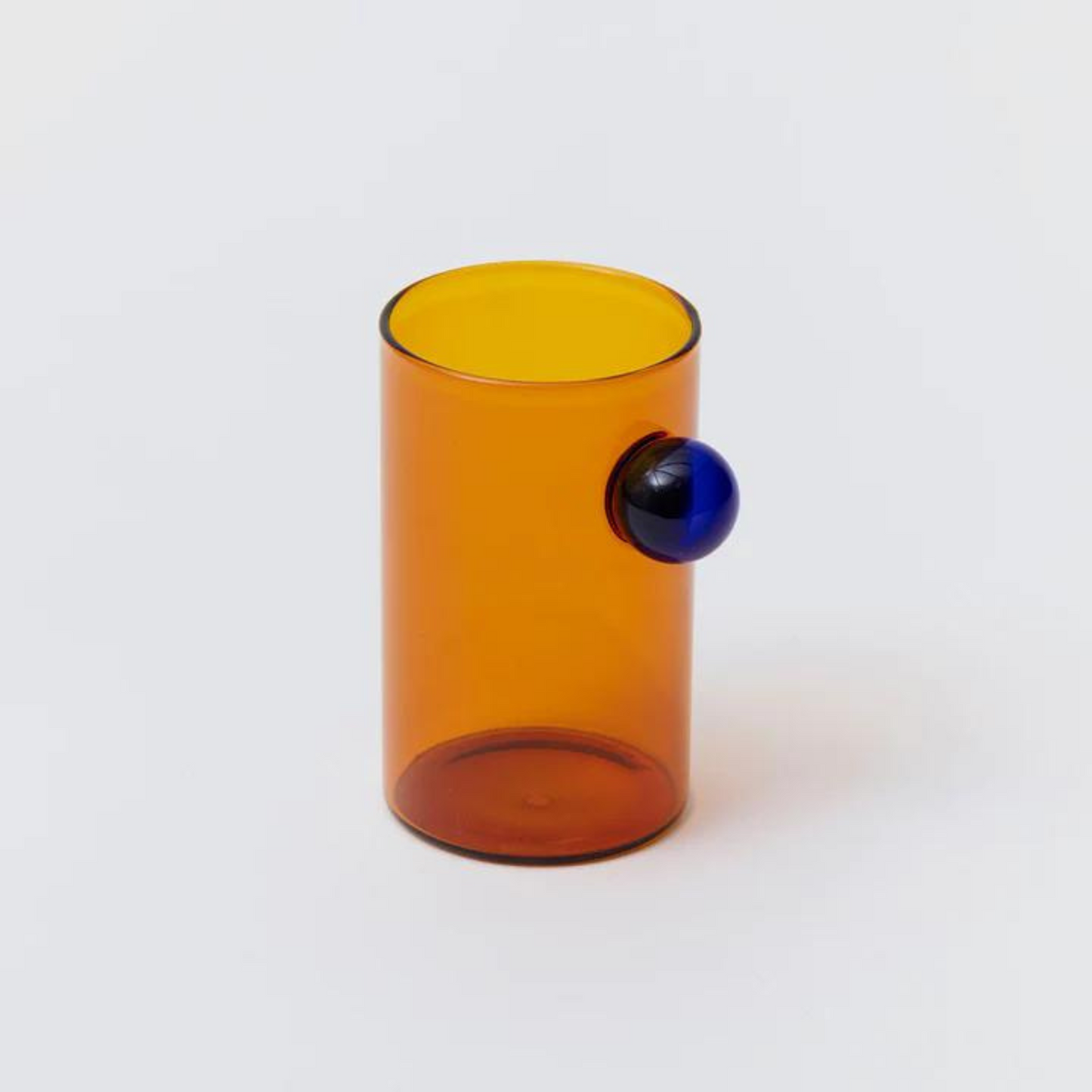 amber water glass with bubble detail.