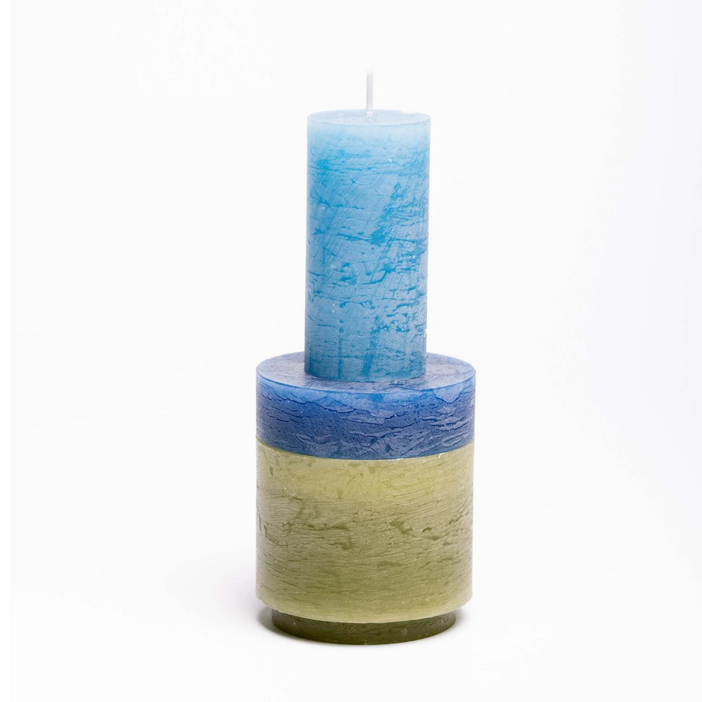 candle made up of 3 different colour components, stacked vertically.