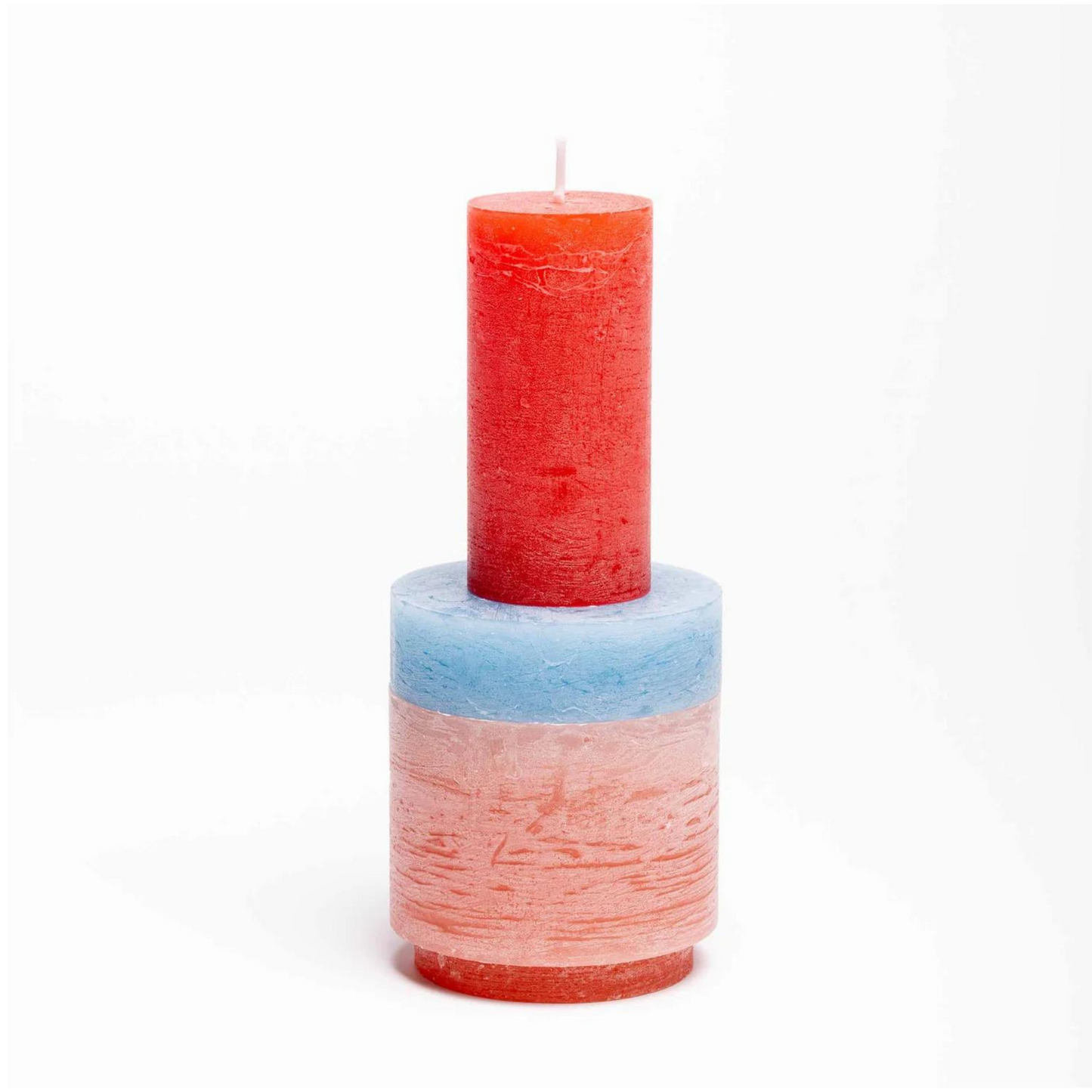 candle made up of 3 different colour components, stacked vertically.