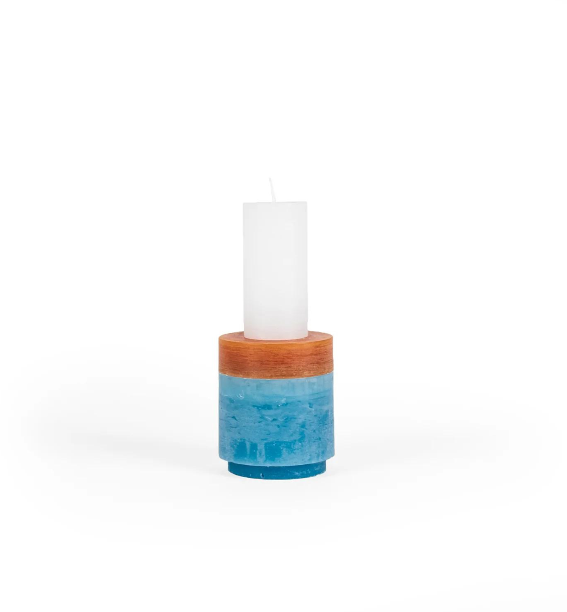 candle made up of 3 different colour components, stacked vertically.