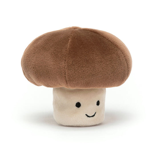A plush toy in the shape of a mushroom with a smiley face