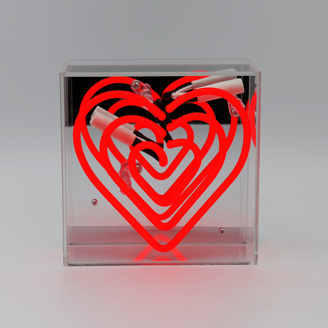 Clear box with red heart design on a grey background