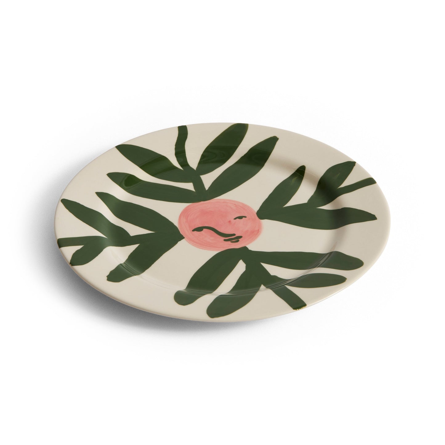 Decorative plate with leaf design on a white background