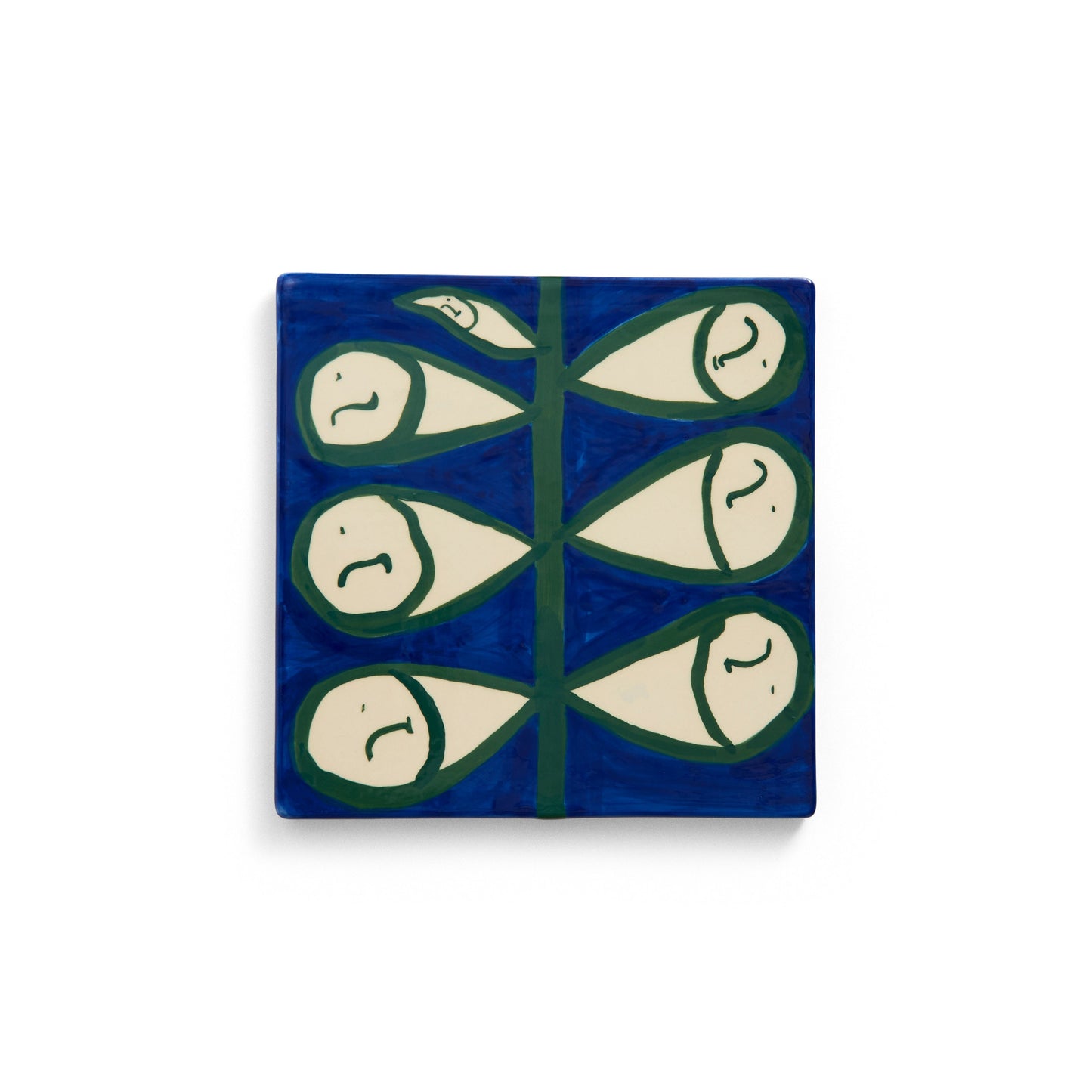 Decorative tile with fish pattern on a blue background