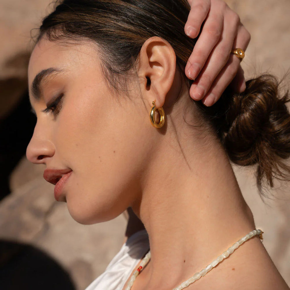 
                  
                    Caprice Gold Hoop Earrings
                  
                