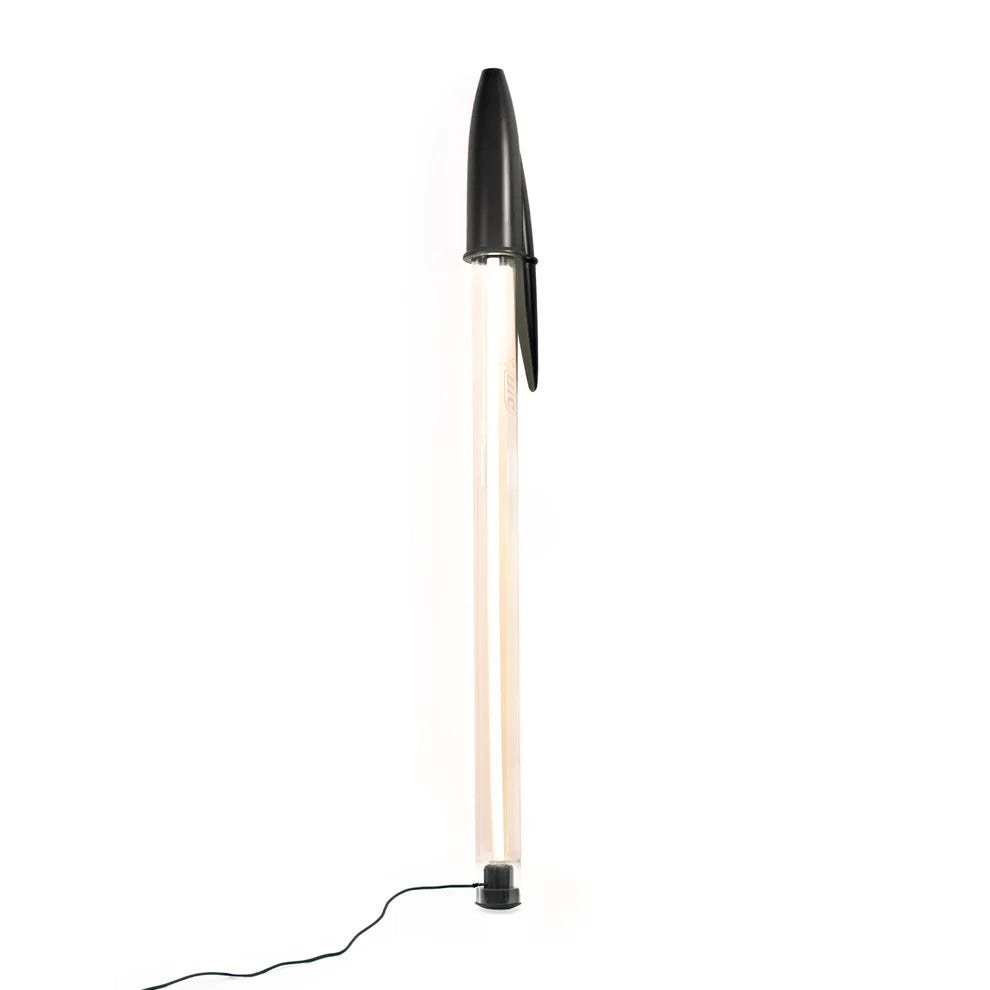 Modern floor lamp with black base and top on a white background