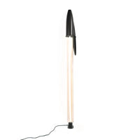 Modern floor lamp with black base and top on a white background