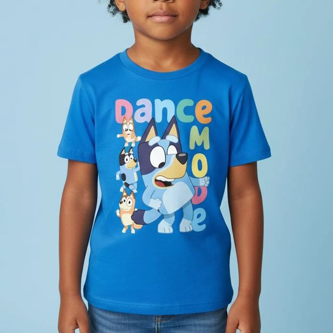 Child wearing a blue t-shirt with cartoon character and 'Dance Mode' text on a light blue background