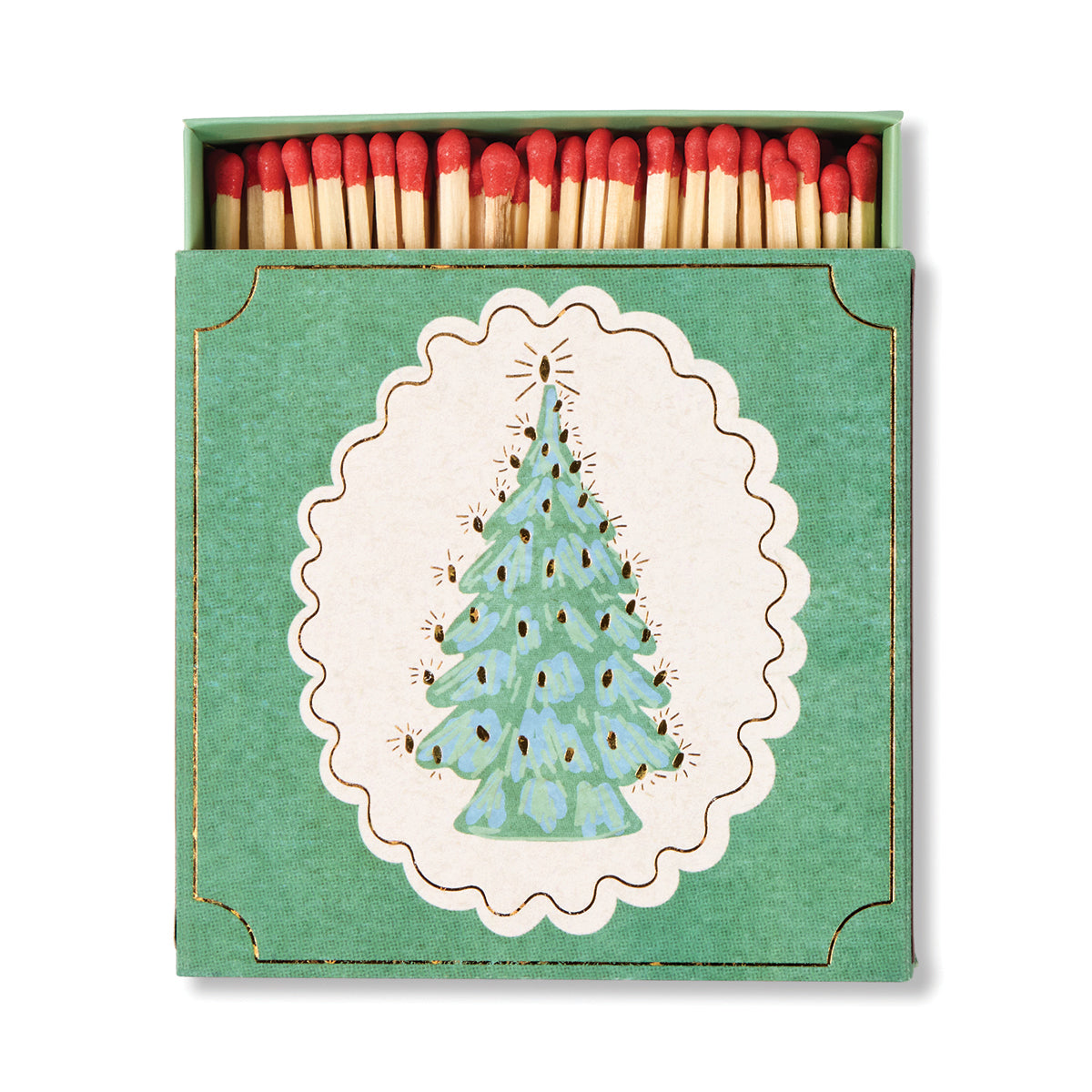 A decorative matchbox set with a green box featuring a white scalloped oval and a light blue Christmas tree illustration. The box is open to reveal red-tipped wooden matches inside, set against a plain white background.