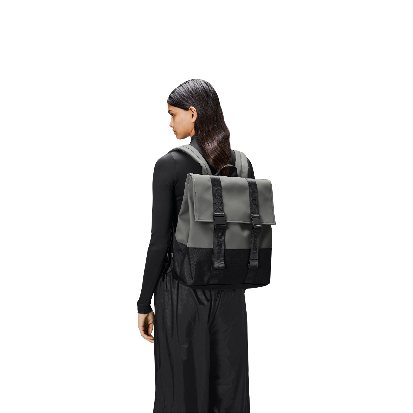 A person carrying the Rains MSN Backpack Mini.