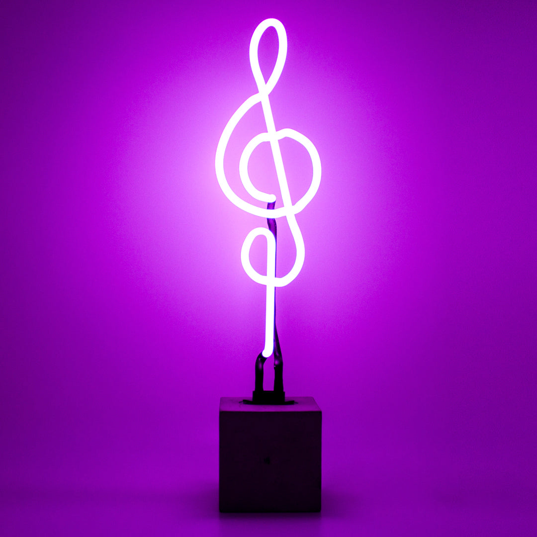 Neon light shaped like a treble clef on a purple background