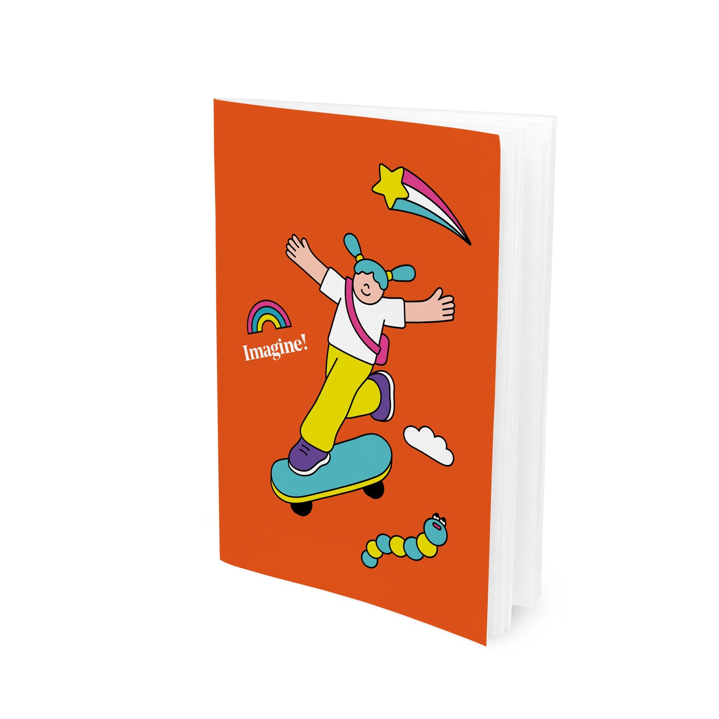 An orange paperback notebook with a cartoon character design on the front