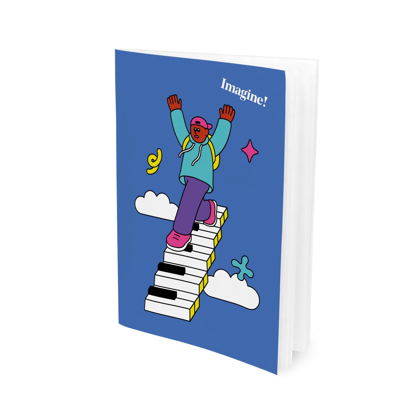 A blue paperback notebook with a cartoon character design walking on a piano