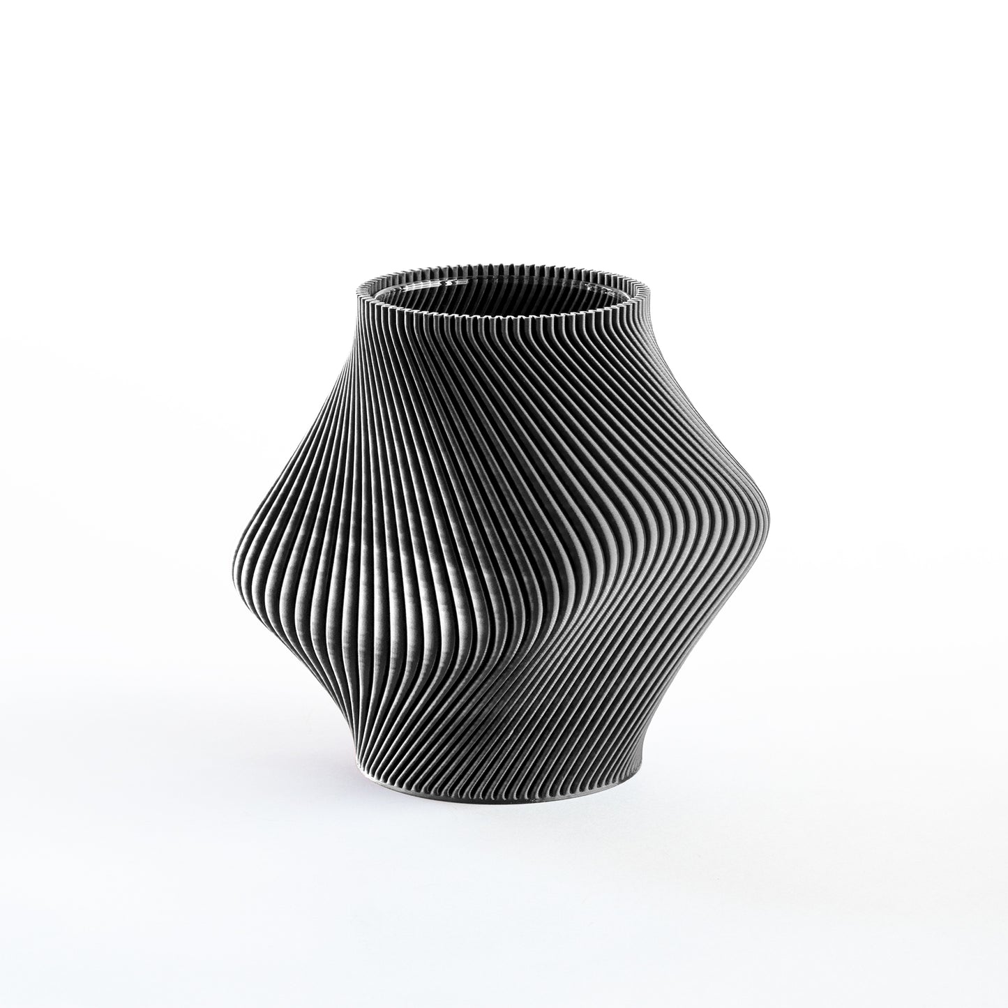 Black textured vase on a white background