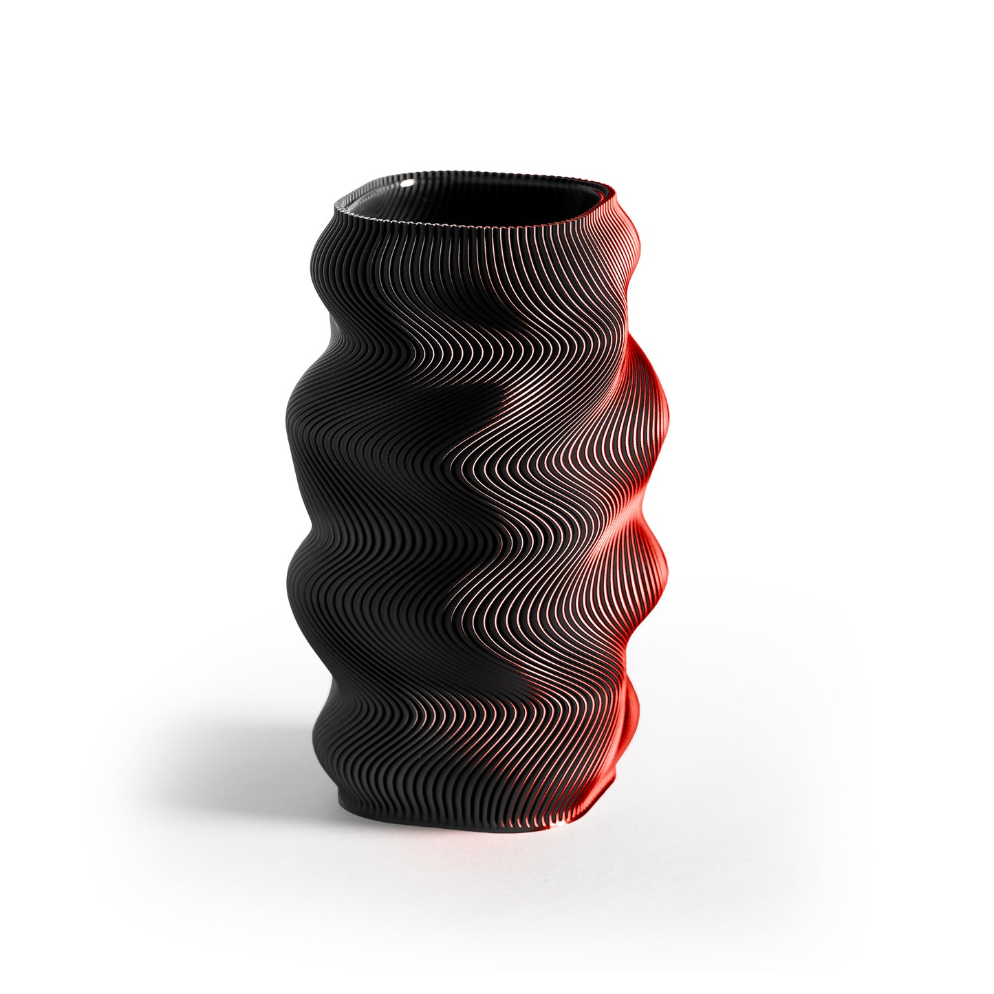 Black and red wavy-patterned vase on a white background