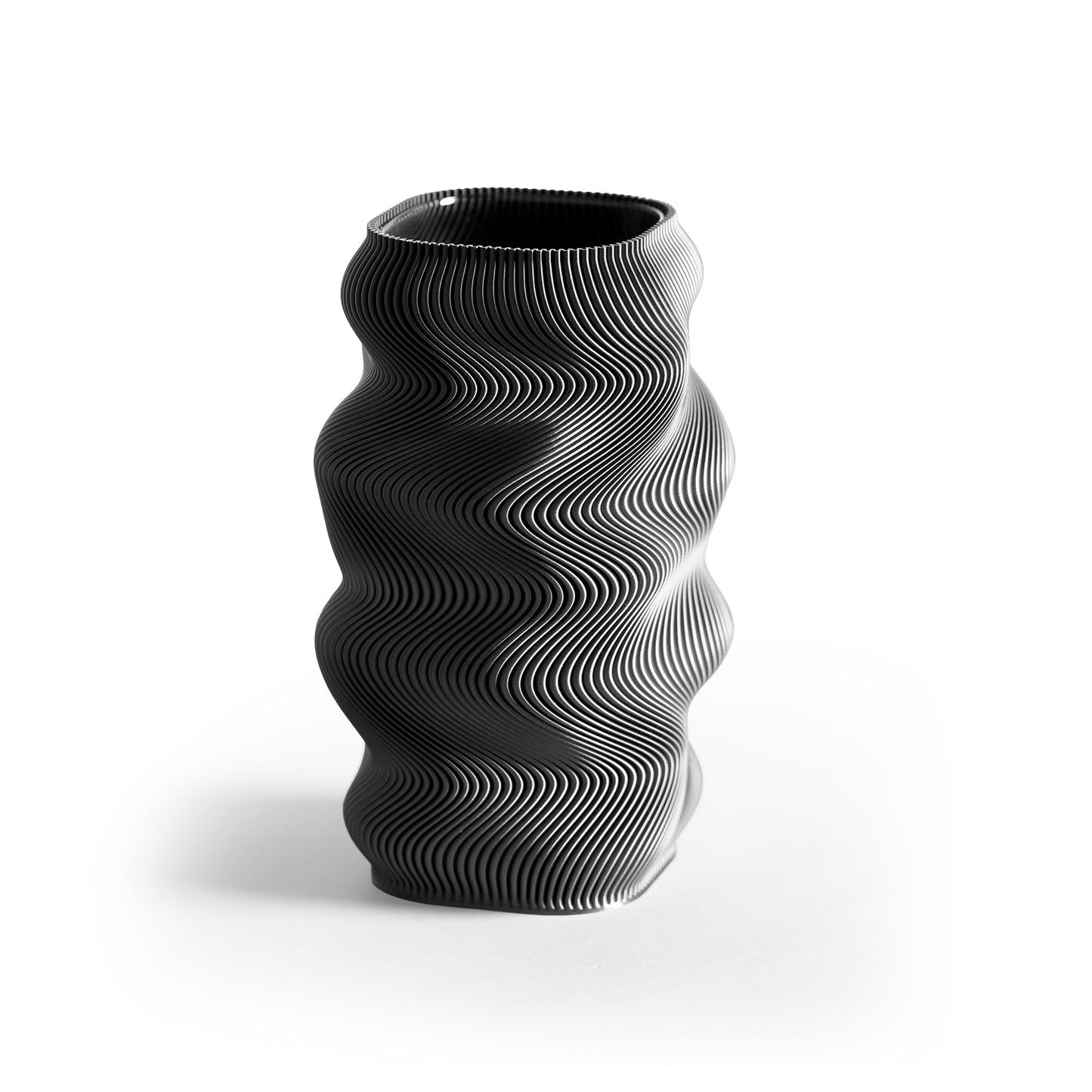 Black wavy-patterned vase on a white background