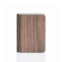 A closed walnut smart book light, designed to masquerade as a regular book.