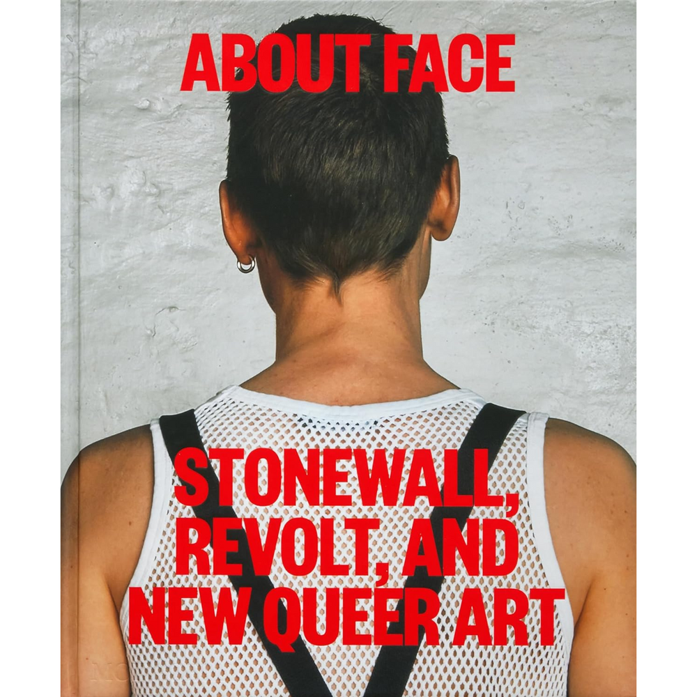 Front cover of About Face, depicting a person facing a wall.