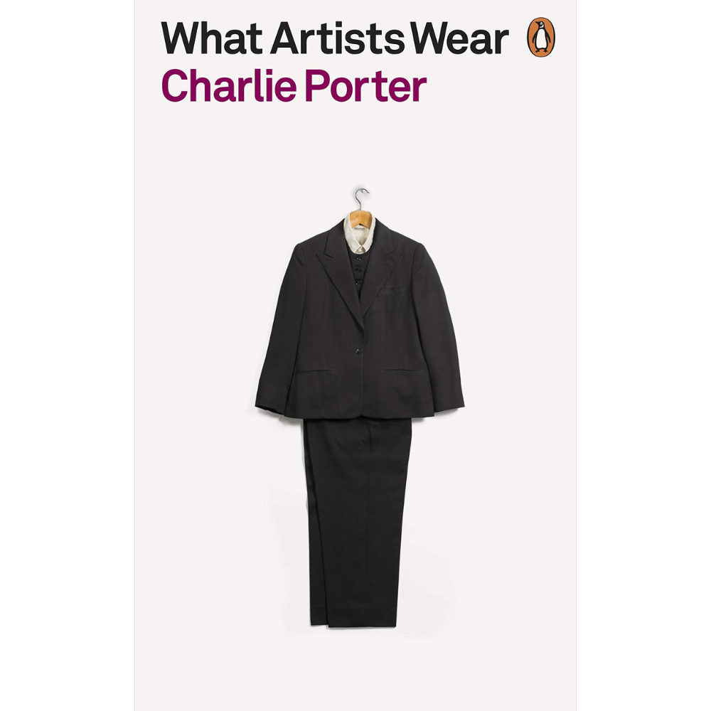 What Artists Wear book front cover showing a black suit on a wooden clothing hanger.
