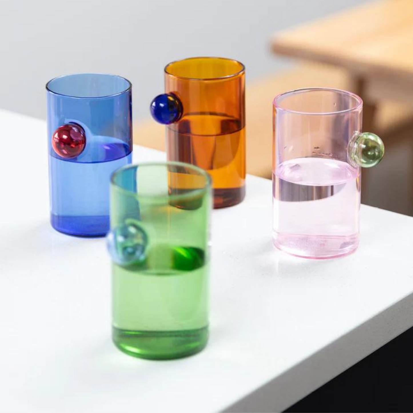 Load image into Gallery viewer, colourful water glass with bubble detail.
