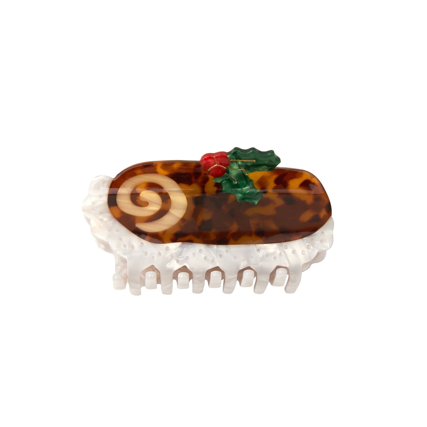 A claw clip in the shape of a Christmas Yule Log on white background