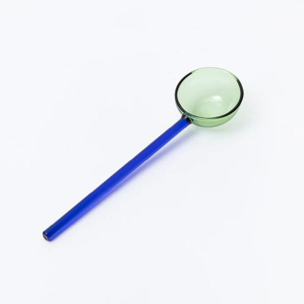 
                      
                        blue and green glass spoon.
                      
                    