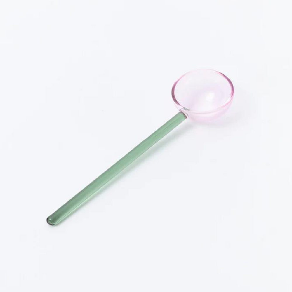 
                      
                        green and pink glass spoon.
                      
                    