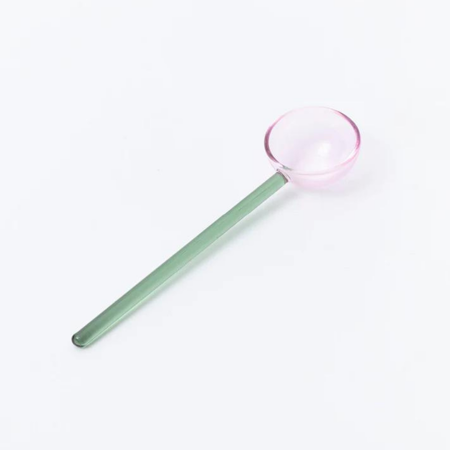 green and pink glass spoon.
