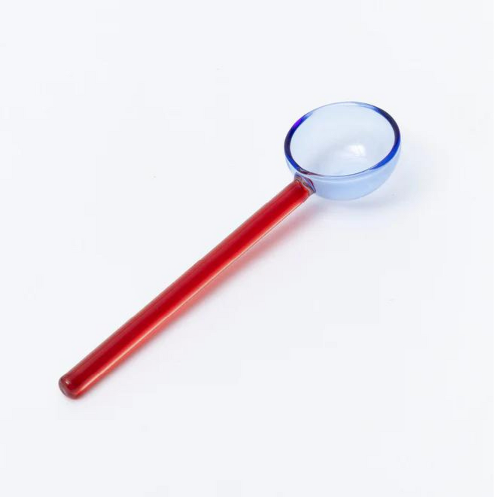 
                      
                        red and blue glass spoon.
                      
                    