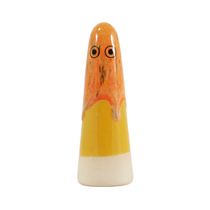 A cone-shaped ceramic figurine with hand-painted eyes