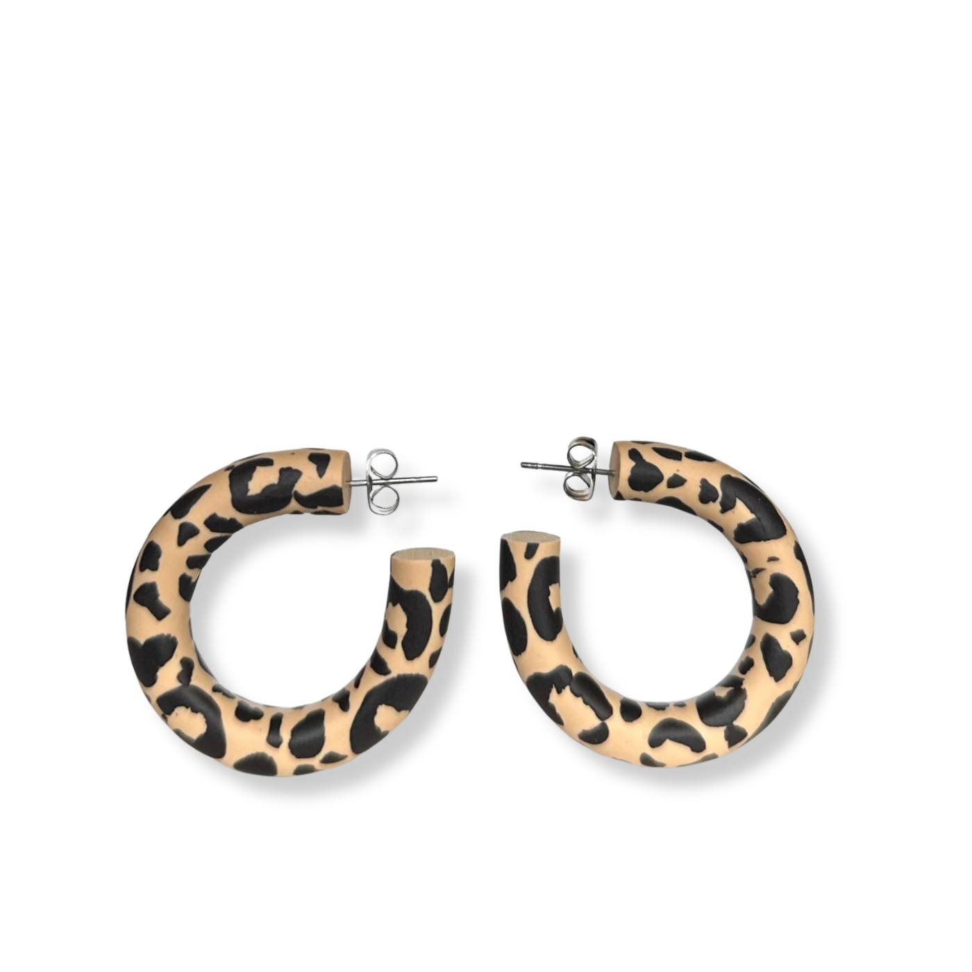 Leopard print hoop earrings on a white background
