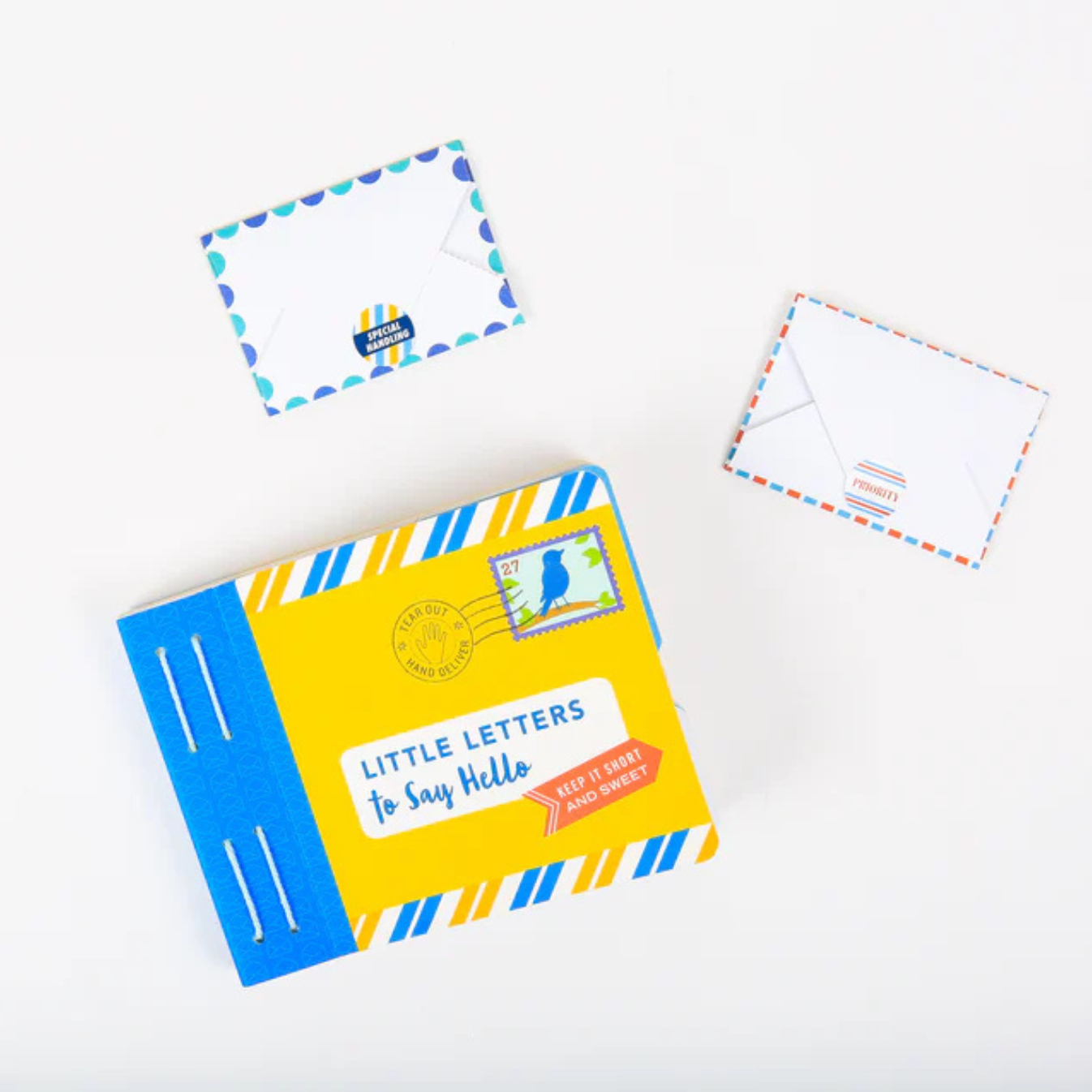 Box of 'Little Letters to Say Hello' with two envelopes on a white background