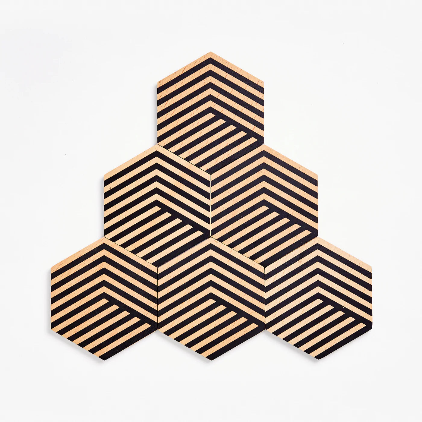 A set of 6 striped hexagon shaped coasters arranged in a pyramic