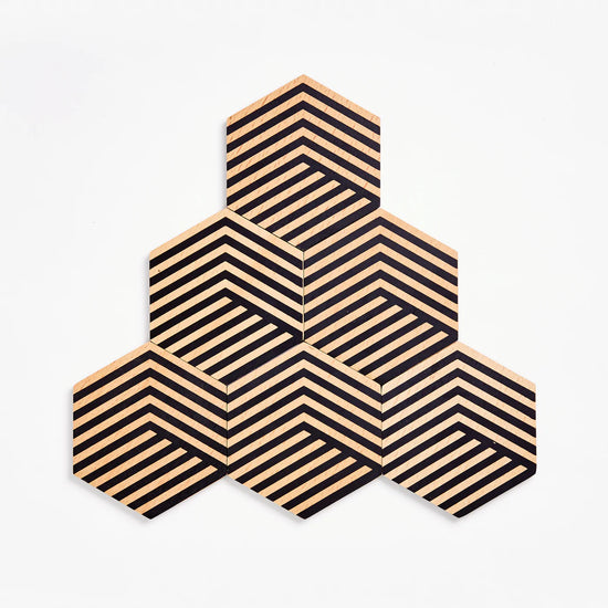 Load image into Gallery viewer, A set of 6 striped hexagon shaped coasters arranged in a pyramic
