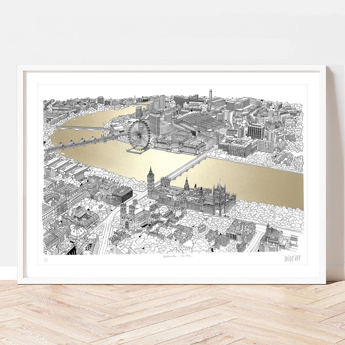 A framed print of an illustration of Westminster and the River Thames in gold.