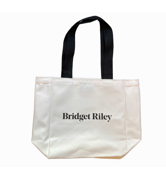 White Canvas Tote Bag with "Bridget Riley" text in black across the middle and a black handle