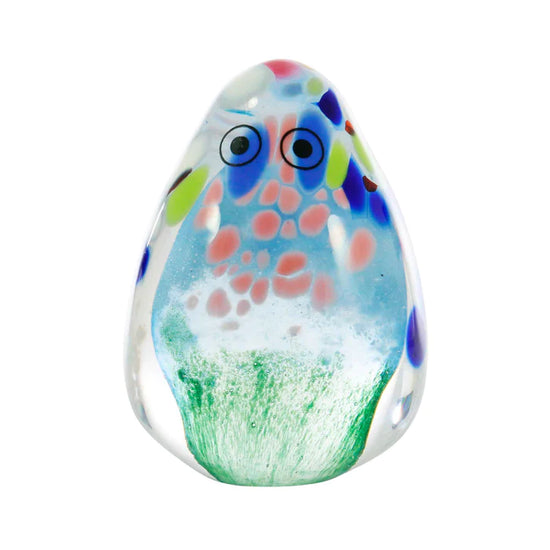 A glass figurine with painted eyes
