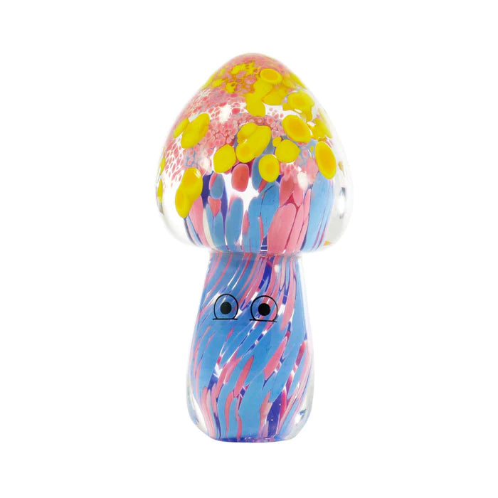 A glass long mushroom-shaped figurine with painted eyes