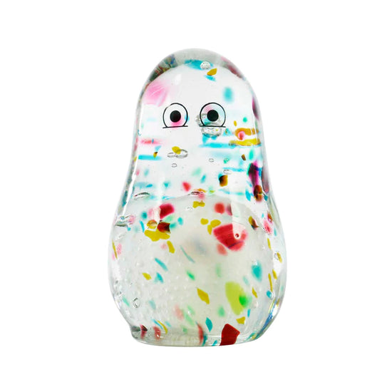 A glass figurine with painted eyes