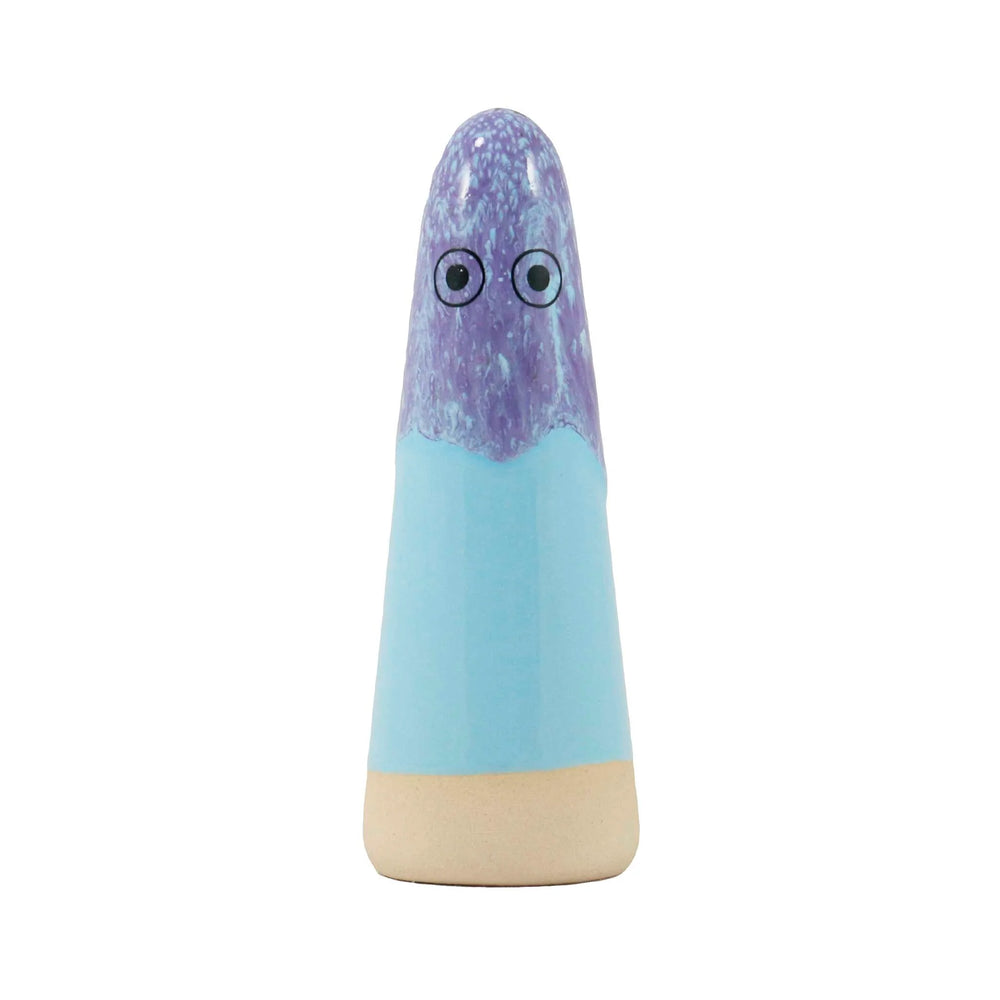 A cone-shaped ceramic figurine with hand-painted eyes