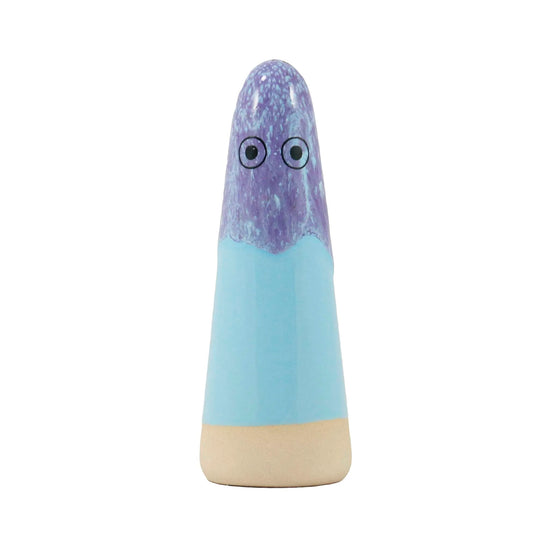 A cone-shaped ceramic figurine with hand-painted eyes