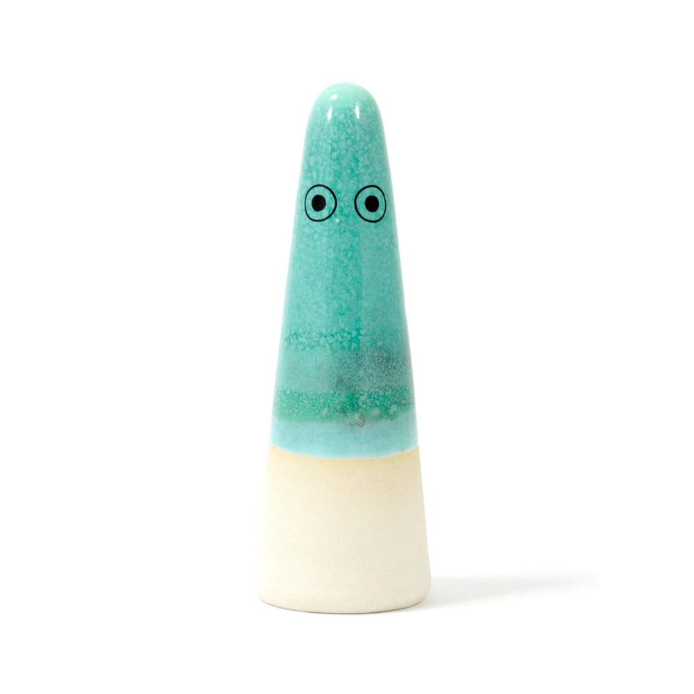 
                  
                    A cone-shaped ceramic figurine with hand-painted eyes
                  
                