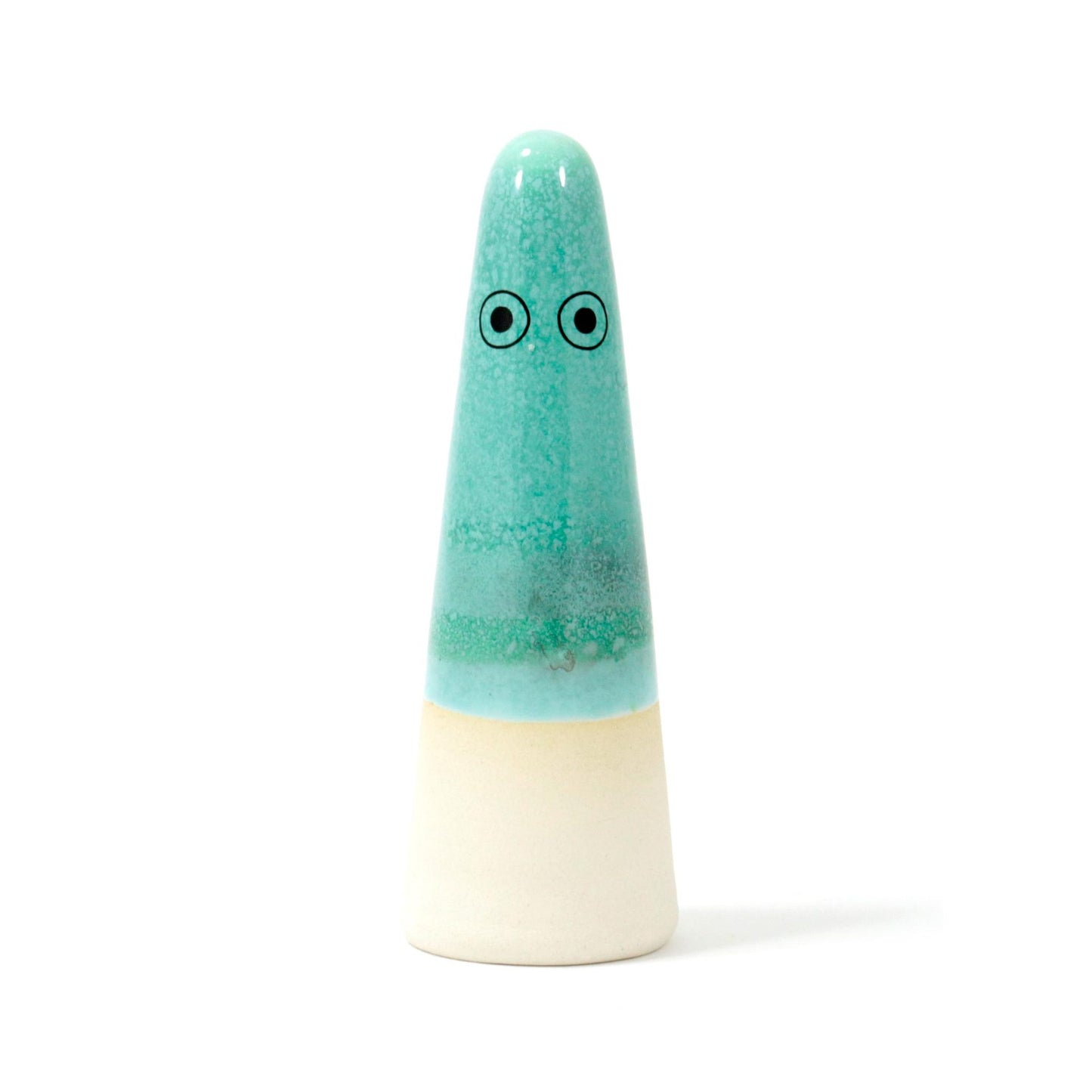 A cone-shaped ceramic figurine with hand-painted eyes